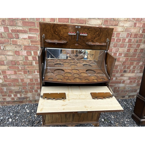 2 - A 1920's walnut cocktail drinks cabinet with mirror glass interior 74 x42x 123