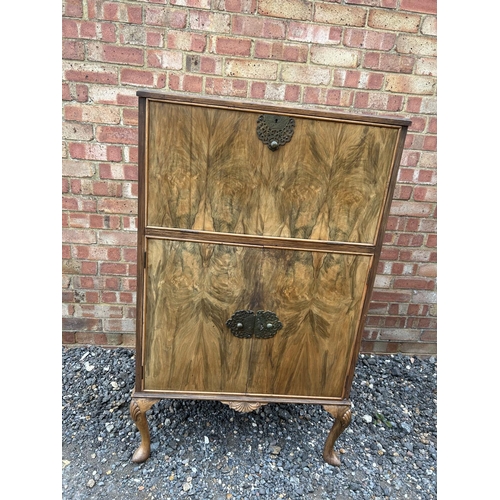 2 - A 1920's walnut cocktail drinks cabinet with mirror glass interior 74 x42x 123