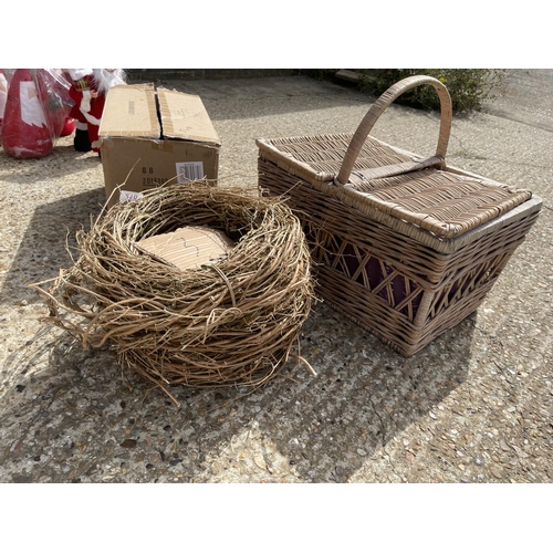 210 - Three wicker wreaths and hamper