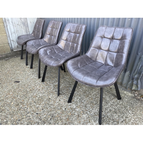 219 - A set of four modern grey leather dining chairs with metal legs