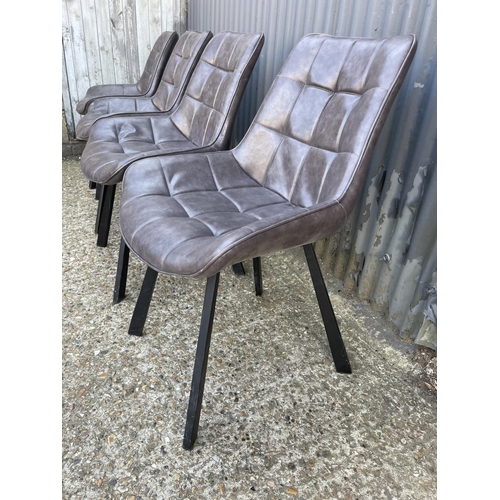 219 - A set of four modern grey leather dining chairs with metal legs