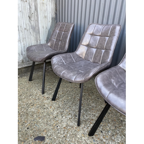 219 - A set of four modern grey leather dining chairs with metal legs