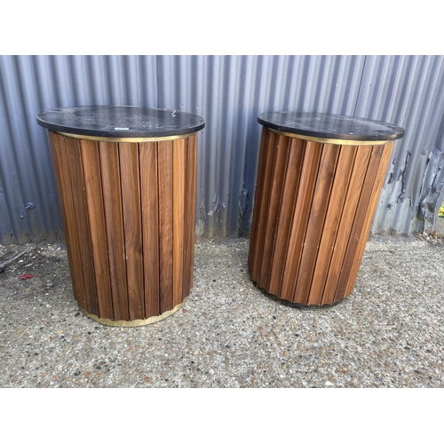 221 - A pair of marble topped bar tables with walnut an brass sides 77h 57round