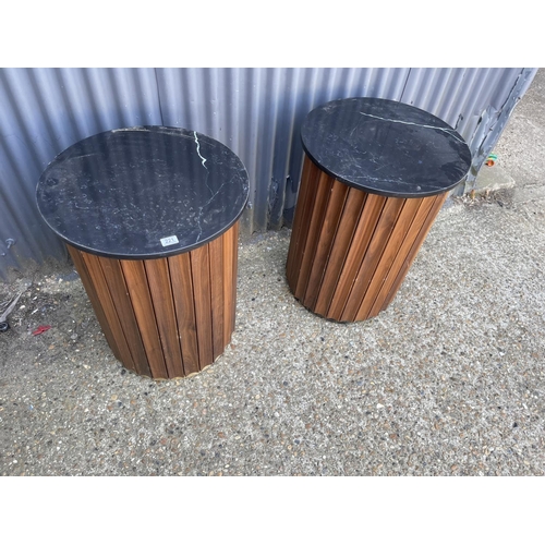 221 - A pair of marble topped bar tables with walnut an brass sides 77h 57round