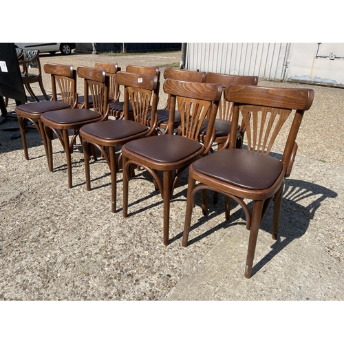 227 - A set of 9 bentwood cafe chairs with brown leather seats