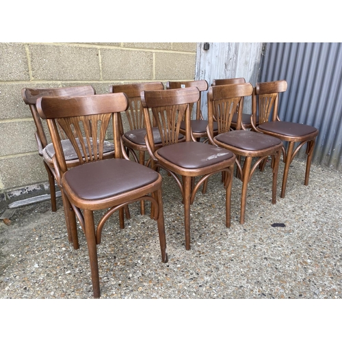 228 - A set of 8 bentwood cafe chairs with brown leather seats