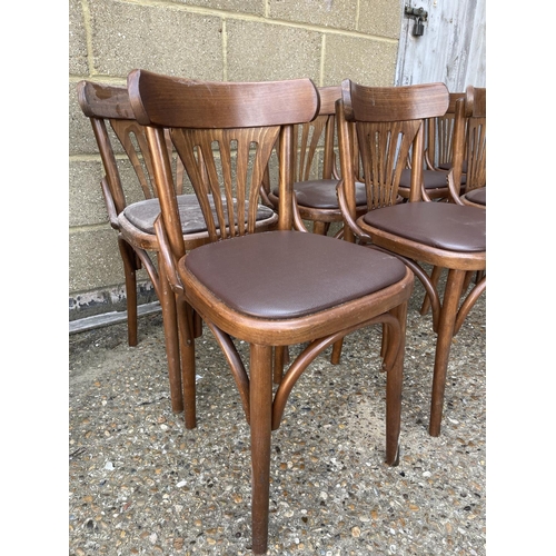 228 - A set of 8 bentwood cafe chairs with brown leather seats