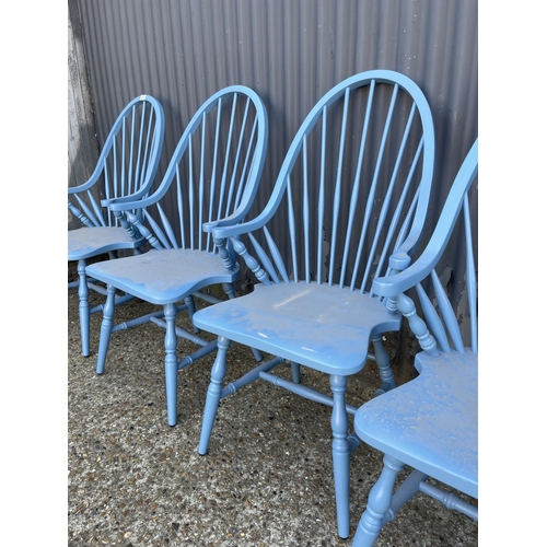 231 - A set of four blue painted comb back carver chairs