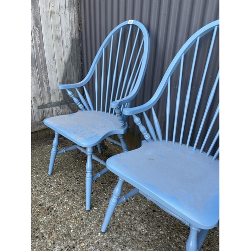 231 - A set of four blue painted comb back carver chairs