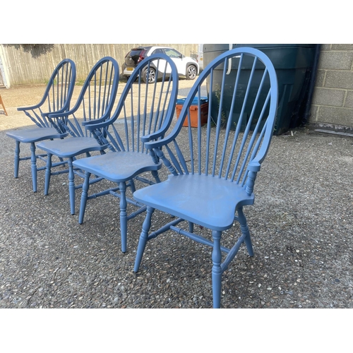 232 - A set of four blue painted comb back carver chairs