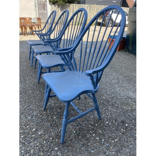 232 - A set of four blue painted comb back carver chairs