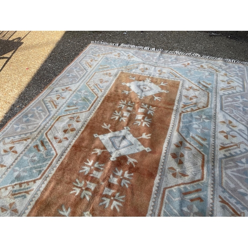 244 - A large Turkish pattern carpet 290x200