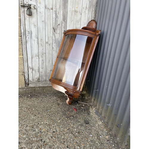 245 - A Victorian mahogany bow glass wall hanging corner cabinet