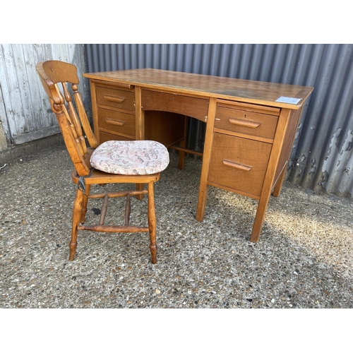 250 - A mid century oak office desk 122x70 together with chair