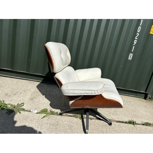 278 - A replica Charles and Ray EAMES white leather armchair