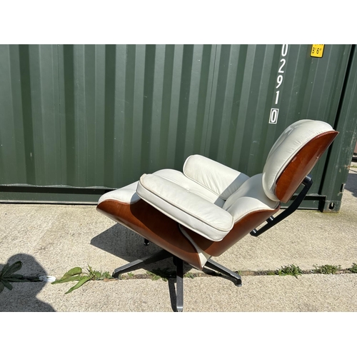 278 - A replica Charles and Ray EAMES white leather armchair