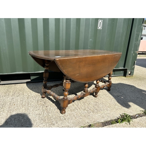 282 - A dark Ercol drop leaf coffee table