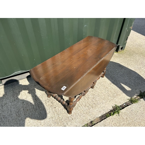 282 - A dark Ercol drop leaf coffee table