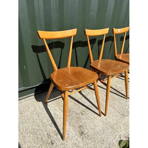 283 - A set of four original Ercol stacking chairs