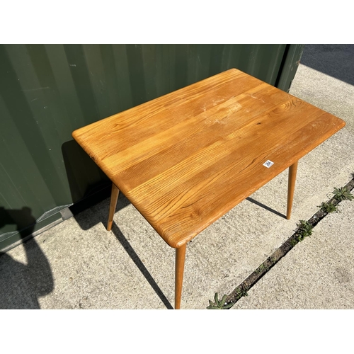 284 - A mid century Ercol kitchen table with slatted lower tier