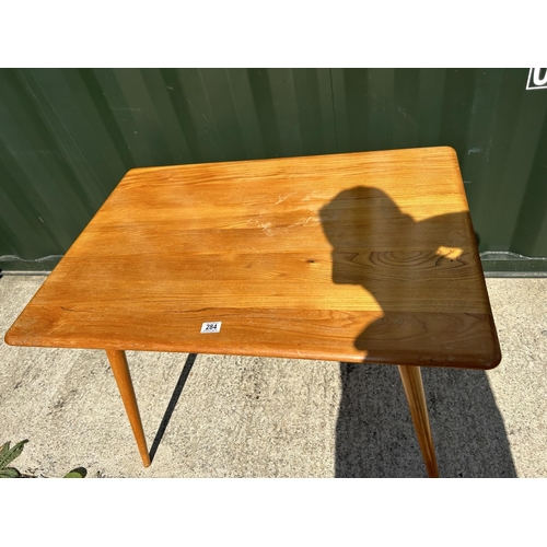 284 - A mid century Ercol kitchen table with slatted lower tier