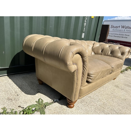 286 - A golden brown leather chesterfield club style sofa