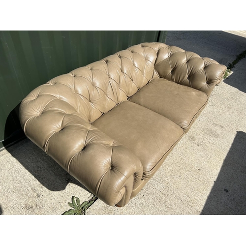 286 - A golden brown leather chesterfield club style sofa