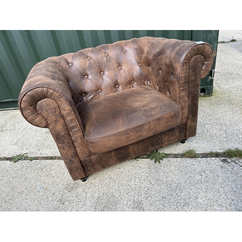 288 - A brown suede chesterfield style chair