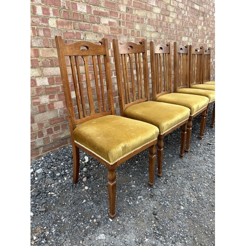 29 - A set of six early 20th century hardwood dining chairs with gold upholstered seats