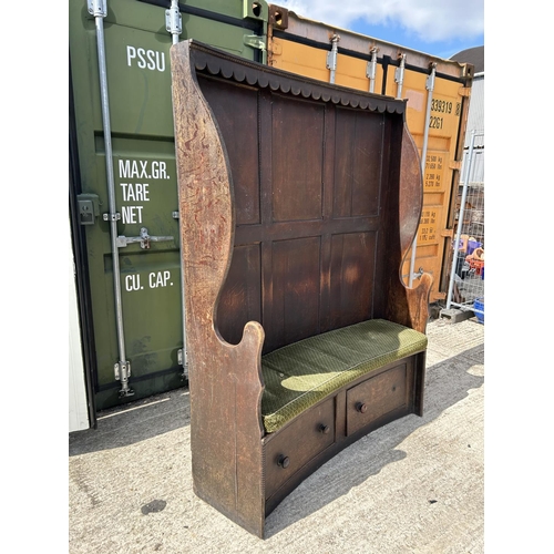 291 - An oak barrel back bench seat with two drawers 157x41x194