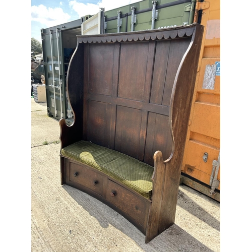 291 - An oak barrel back bench seat with two drawers 157x41x194