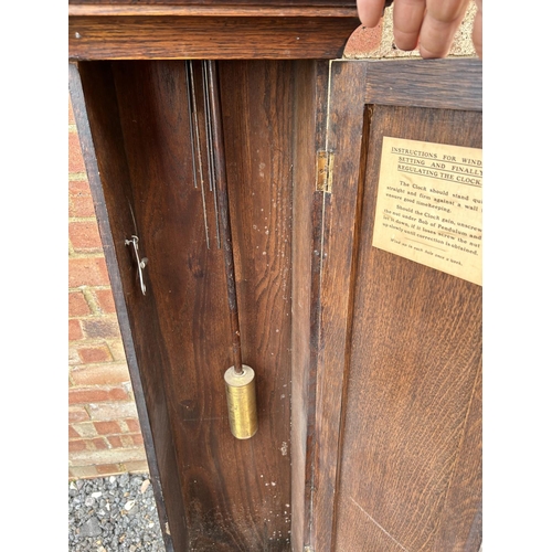 3 - An oak cased TEMPUS FUGIT grandmother clock supplied by WARING & GILLOW London