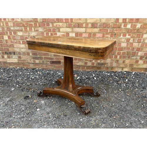 33 - A Victorian rosewood fold over card table with green baize