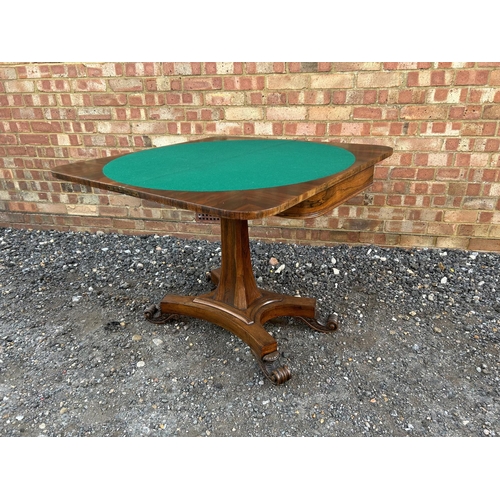 33 - A Victorian rosewood fold over card table with green baize