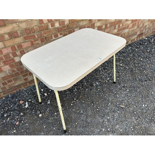 35 - A white formica top kitchen table 107x68x77