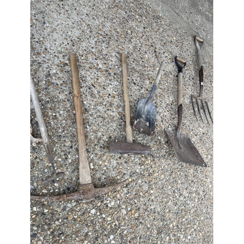 421 - Grease gun, garden tools inc pick axe etc