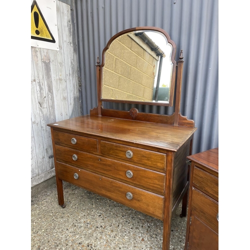 55 - An Edwardian mahogany bedroom pair consisting of a four drawer dressing table and a washstand chest