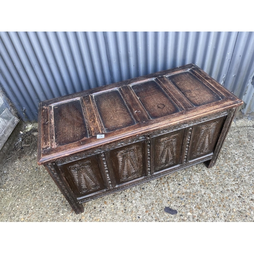 74 - A carved oak blanket box chest 118 x55x65