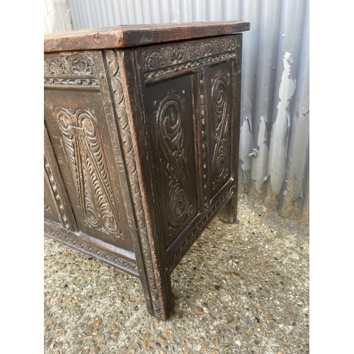 74 - A carved oak blanket box chest 118 x55x65