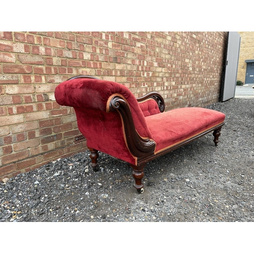 8 - A red upholstered Victorian chaise longue 184 cm long