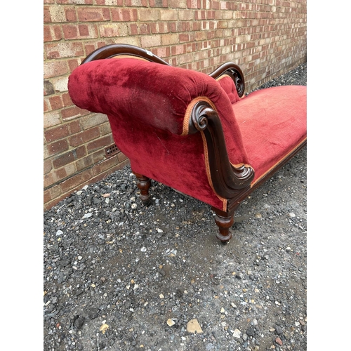 8 - A red upholstered Victorian chaise longue 184 cm long