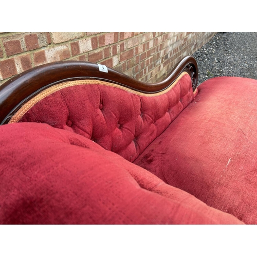 8 - A red upholstered Victorian chaise longue 184 cm long