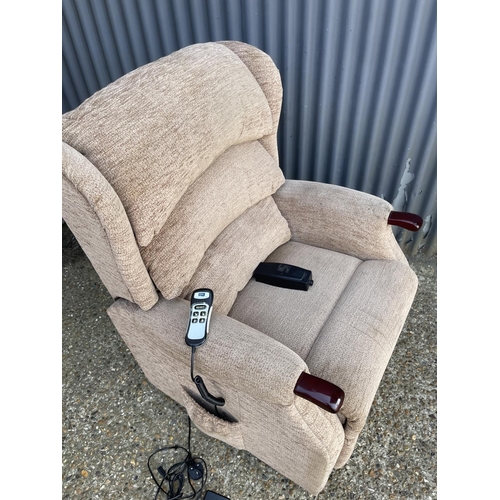 80 - A brown upholstered electric rise and recline chair by HSL