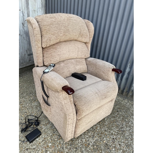 80 - A brown upholstered electric rise and recline chair by HSL