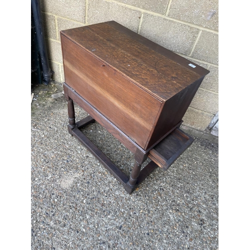 86 - An unusual oak stationery / record cabinet with drop down door on single drawer stand