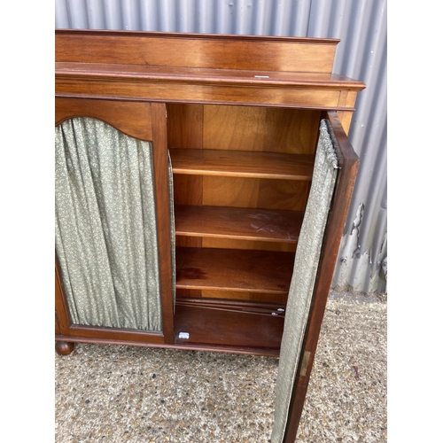 97 - An Edwardian mahogany glazed cabinet with internal shelves