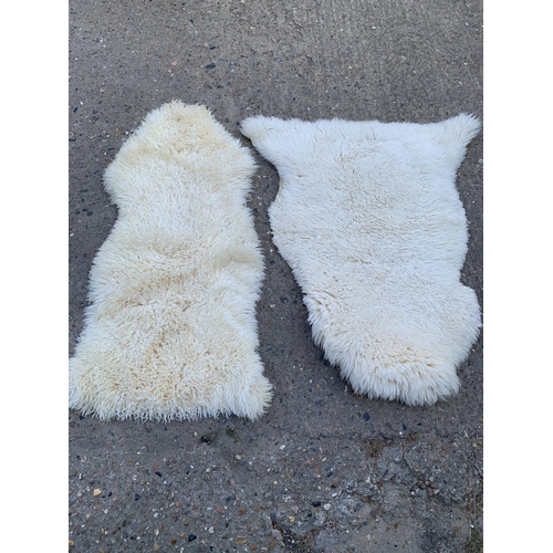 1048 - Two sheepskin rugs