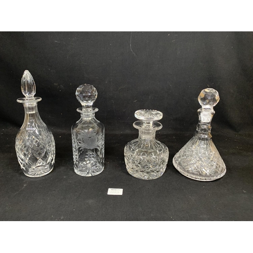 1053 - Four heavy cut glass Decanters (no damage)