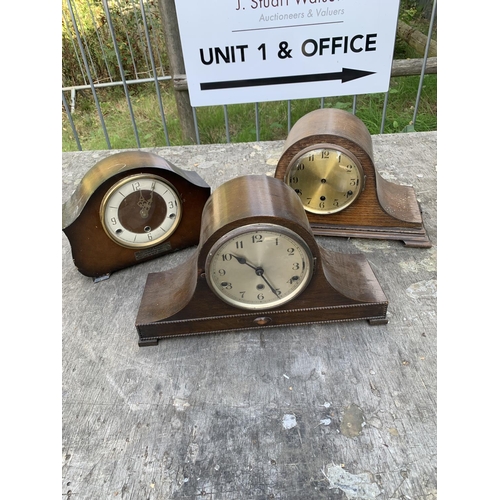 Three chiming mantel clocks