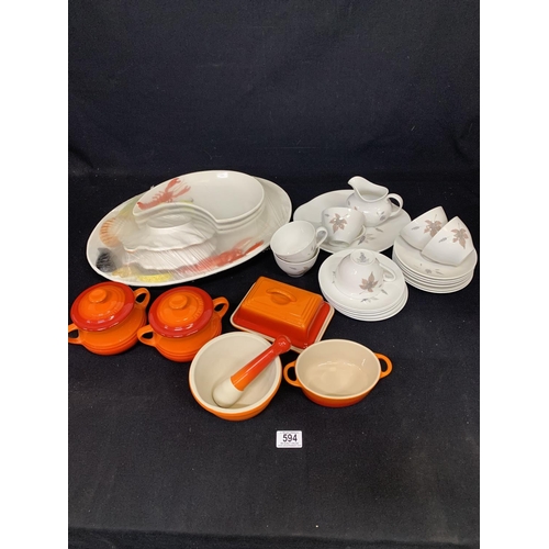 594 - 5 pieces orange Le Creuset kitchenware, pottery fish set and 20 piece Doulton Tumbling leaves teaset... 